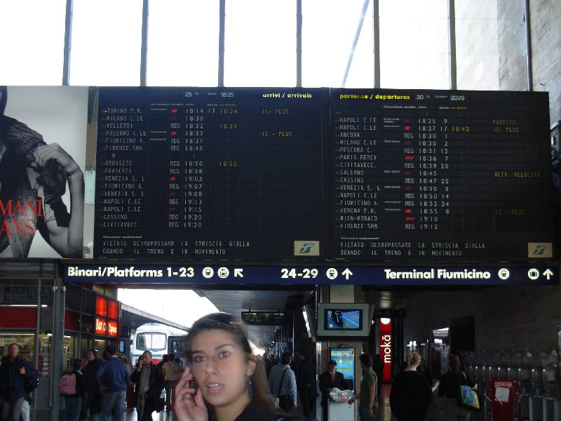 The time table at Roma Termini and a nice girl who crossed by accident while I was taking the picture :-)